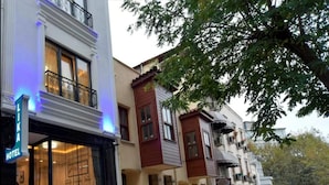 A hotel with a modern facade, large windows, and a visible entrance. - Lika Hotel - Eco Double Room (Istanbul)