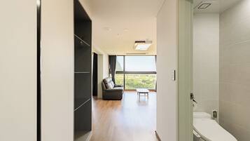 A modern bathroom with a toilet and a shower area.