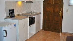 A compact kitchen with a built-in oven, a coffee maker, and a sink. - Studio Apartments Maria With Pool and Amazing View - Agios Gordios Beach (Corfu)