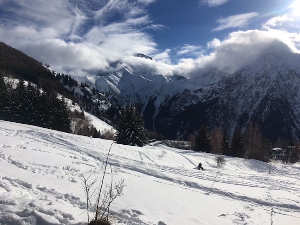 A snowy mountain landscape with a clear sky.