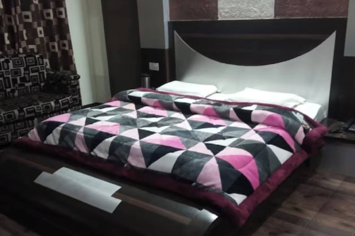 Premium bedding, down duvets, memory-foam beds, in-room safe