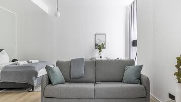 Suite XL with sofa bed | Area soggiorno | Smart TV 50 pollici con canali via cavo, TV