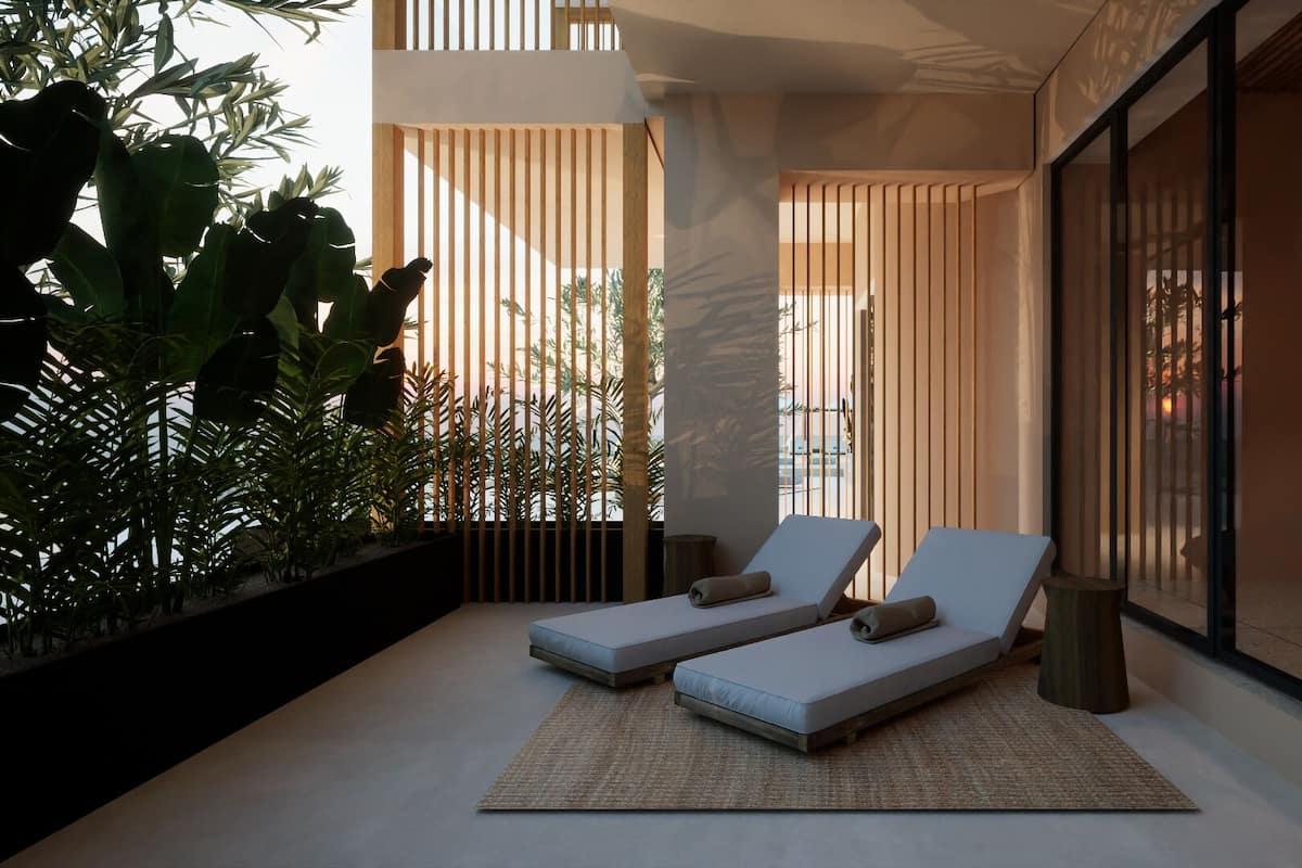A modern outdoor lounge area with two lounge chairs, a woven rug, and a view of a pool and palm trees.