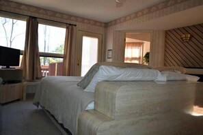 1 bedroom, desk, iron/ironing board, travel crib