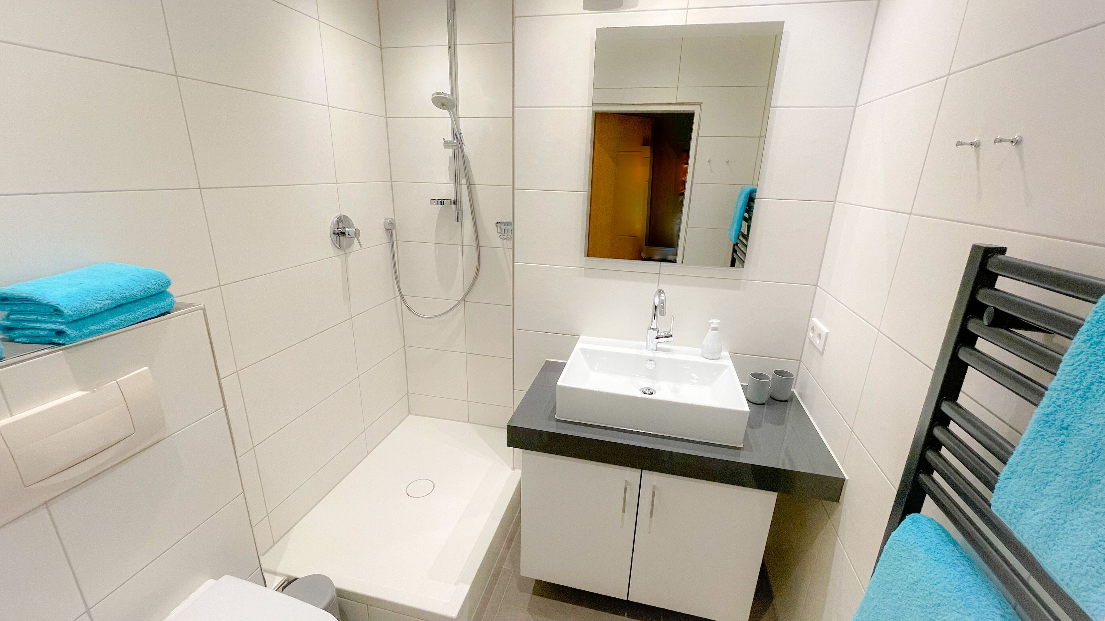 Shower, hair dryer, towels, soap