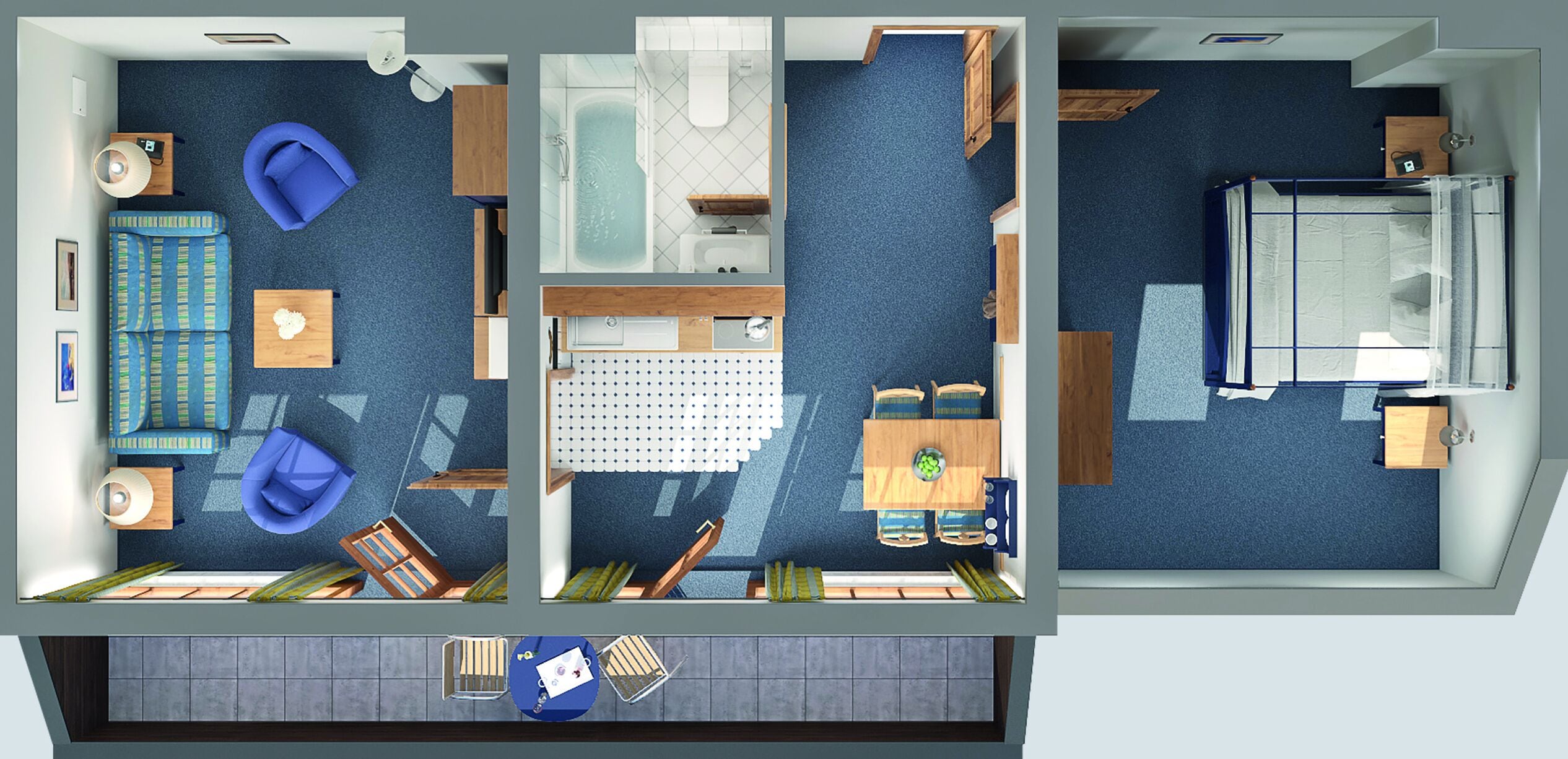 A hotel room with a blue carpet, a sofa, a bed, a small table, and a bathroom with a bathtub and toilet.