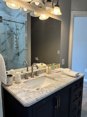 Shower, hair dryer, towels, soap