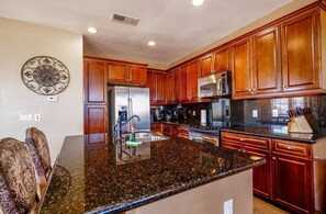 Fridge, microwave, coffee/tea maker, cookware/dishes/utensils