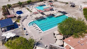 An aerial view of a resort with multiple swimming pools, sun loungers, and covered areas. - Discover Casa Dooley: a spacious 3BR home in San Felipe, perfect for your getaway! (San Felipe)