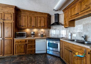 Fridge, microwave, stovetop, coffee/tea maker