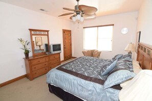 A bedroom with a bed, dresser, television, and a ceiling fan. - Condo 25-1 Luxury Villa - Golf Course Views | El Dorado Ranch | San Felipe (San Felípe)