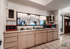 Fridge, microwave, stovetop, coffee/tea maker