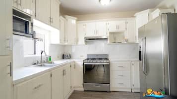 Fridge, microwave, stovetop, coffee/tea maker