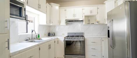 Fridge, microwave, stovetop, coffee/tea maker