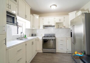 Fridge, microwave, stovetop, coffee/tea maker