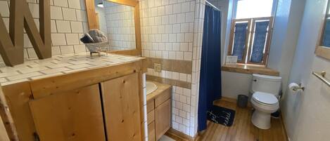 Combined shower/tub, hair dryer, towels, soap