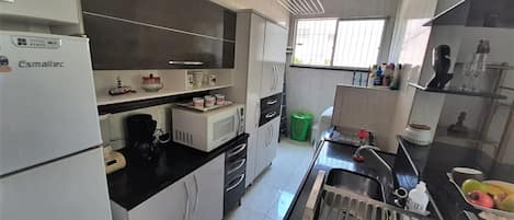 Fridge, microwave, coffee/tea maker, dining tables