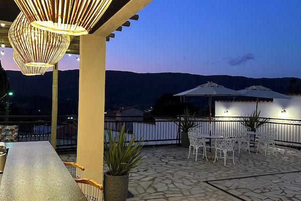 Outdoor pool, pool umbrellas, sun loungers