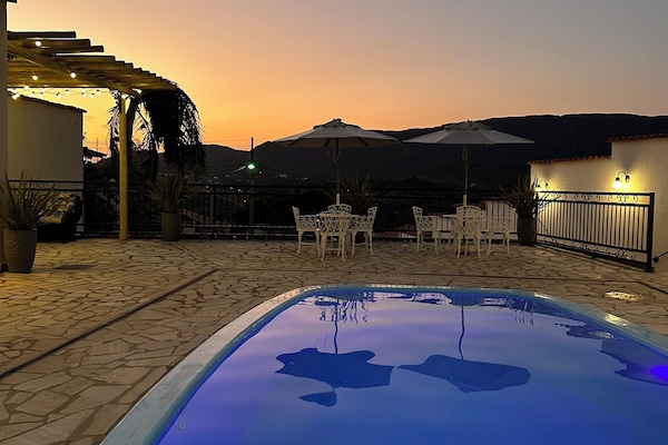 Outdoor pool, pool umbrellas, sun loungers