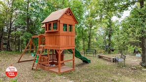 Explore the fun-filled play area with a slide and climbing elements, perfect for kids to burn off energy.