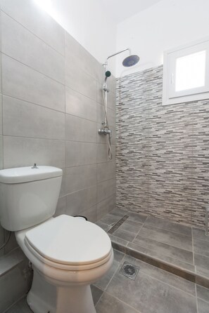 Family Room | Bathroom | Shower, rainfall showerhead, hair dryer, slippers - Euphoria Complex (Corfu)