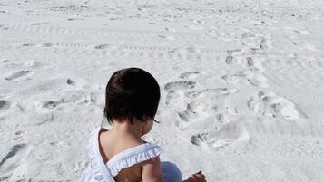 On the beach, sun-loungers, beach towels