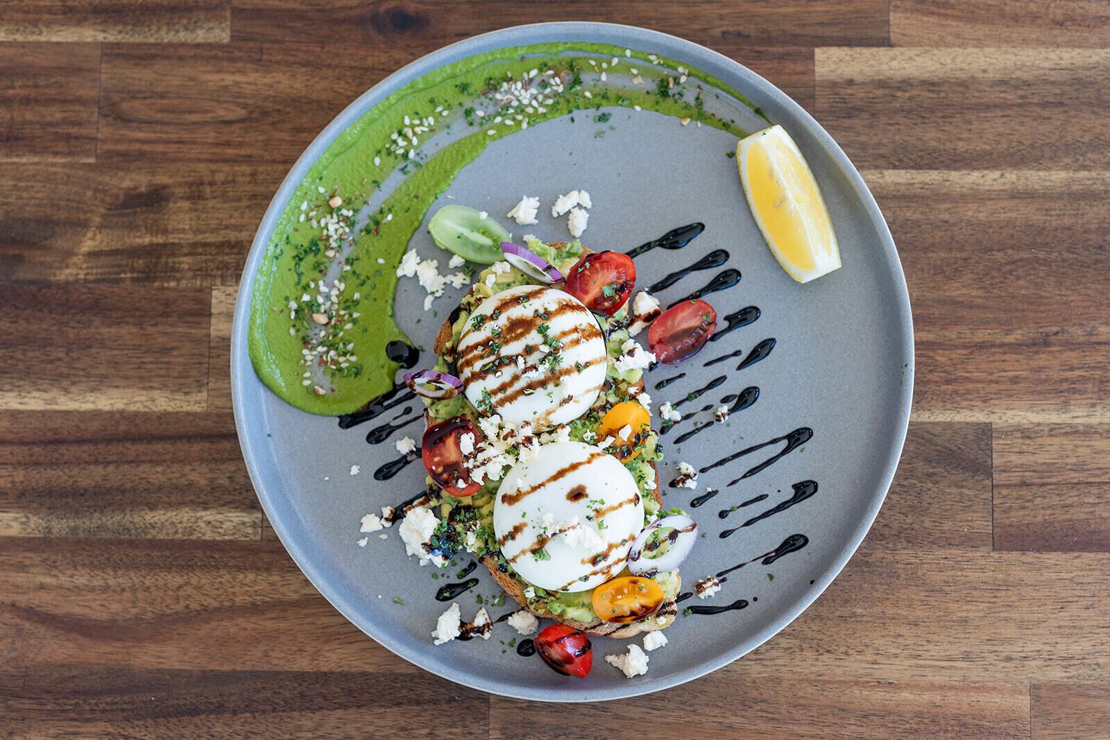 A plate of food with various toppings and sauces.