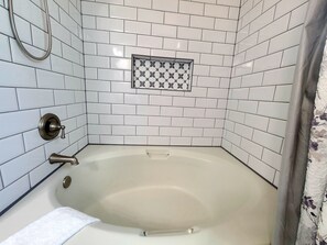 Combined shower/bathtub, hair dryer, towels, soap