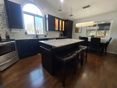 Relax in the Hot Tub, Sleep in Comfort on a King Bed, Play Pool, Charge Your EV