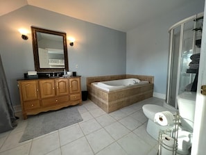 Bathtub, towels, soap, toilet paper