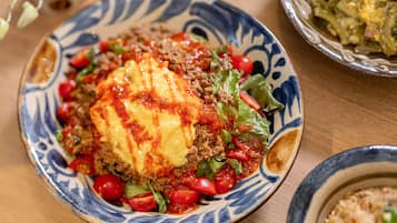A plate of food with a patterned bowl.