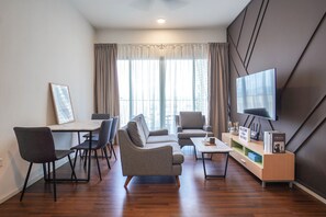 Design Condo, 3 Bedrooms, Balcony, City View | Living area | 67-inch LED TV with digital channels, TV