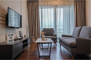 Design Condo, 3 Bedrooms, Balcony, City View | Living area | LED TV