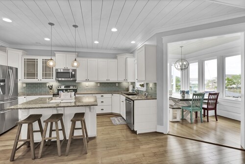 Waterfront; Golf Cart option; hot tub; Kayaks; Peddle Boat; Walk to beach; Ramp