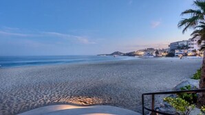 A beach with a staircase leading down to the sand, overlooking the sea. - Mykonos Bay Resort at Zippers Surf Break (San José del Cabo)