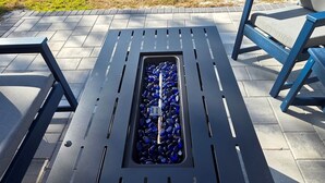A metal bench with a drainage grate in the middle. - “Walk to Beach • Park at Door • 11 Pools • Sleeps 6” (Panama City Beach)