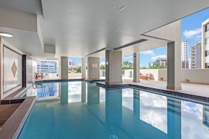 Relax by the pool with a stunning view of the city skyline.