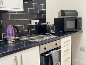 Fridge, cookware/dishes/utensils, spices - Executive Style 2 Bed Flat in Bridgend F2 (Bridgend)