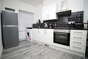 Fridge, cookware/dishes/utensils, spices - Executive Style 2 Bed Flat in Bridgend F2 (Bridgend)
