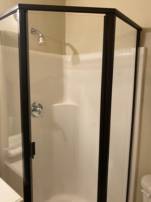 Shower, towels, soap, toilet paper