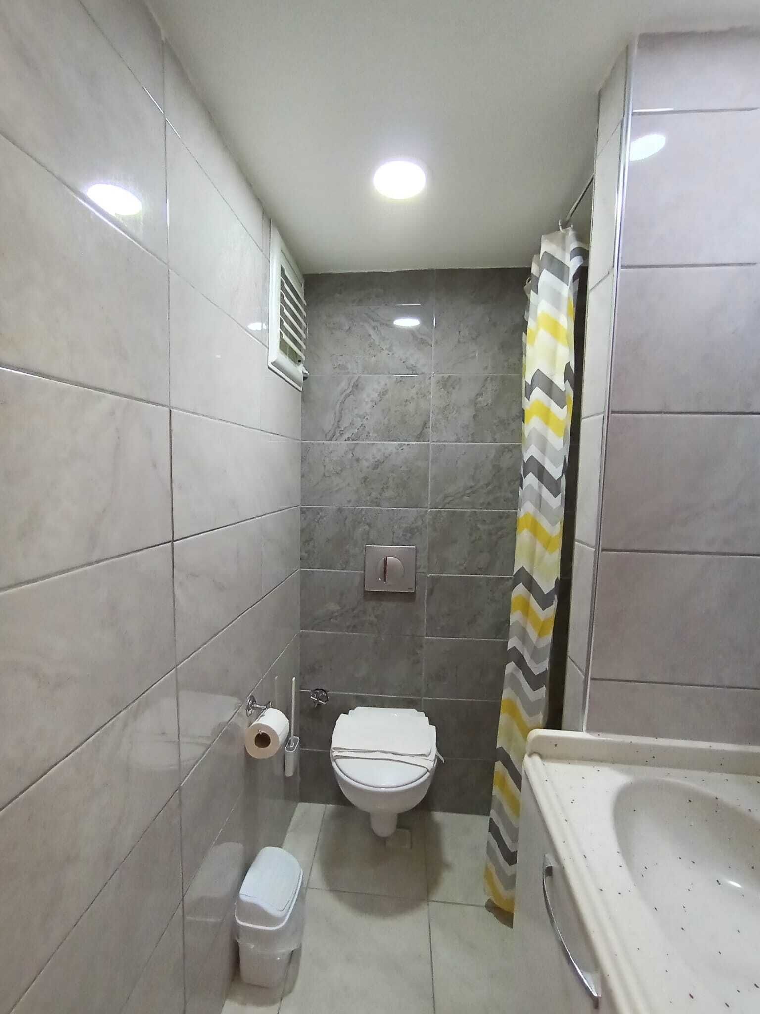 shower, rainfall showerhead, hair dryer, towels