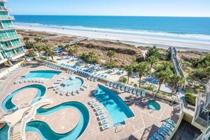 A resort with a large pool area, beach access, and a building with balconies. - New Floor Private Balcony Oceanfront Decor with Pools (North Myrtle Beach)
