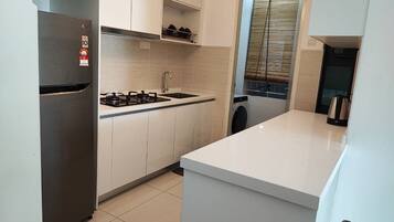 Fridge, electric kettle, cookware/dishes/utensils, spices