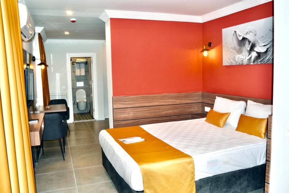 Premium bedding, blackout curtains, iron/ironing board, free WiFi