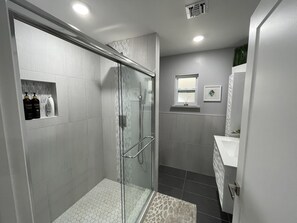 Shower, hair dryer, towels, soap