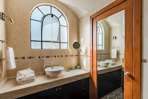 Shower, designer toiletries, hair dryer, towels