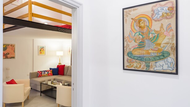 A modern living room with a sofa, armchairs, a coffee table, and a bunk bed. - CasaNa on Christmas Alley (Napoli)