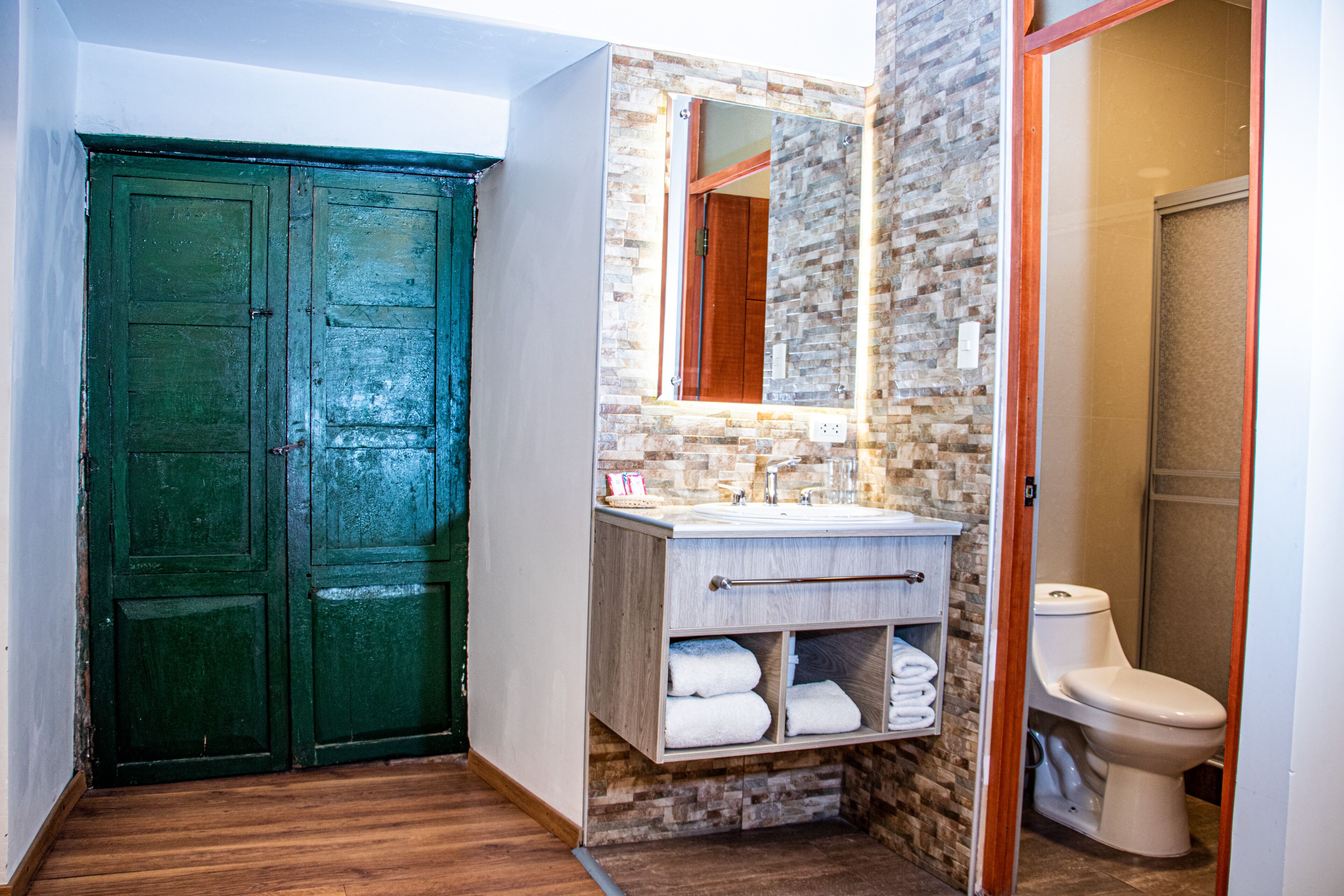 shower, designer toiletries, hair dryer, towels