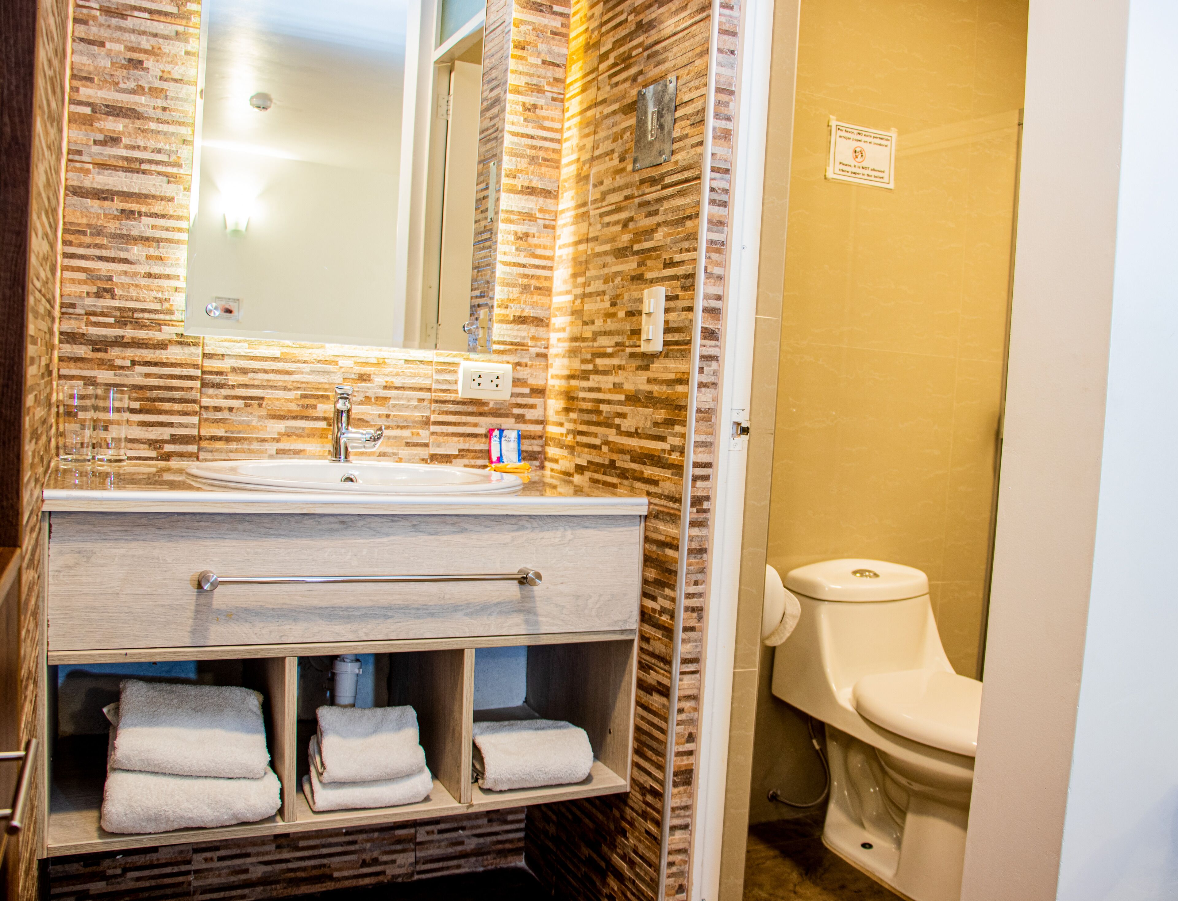 shower, designer toiletries, hair dryer, towels