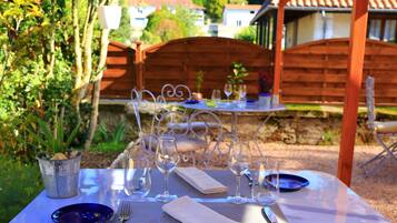 Breakfast, lunch, dinner served; Fusion cuisine, garden views